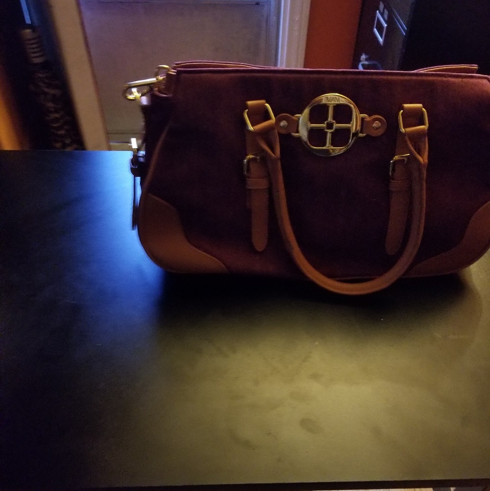 Iman purse burgundy in color